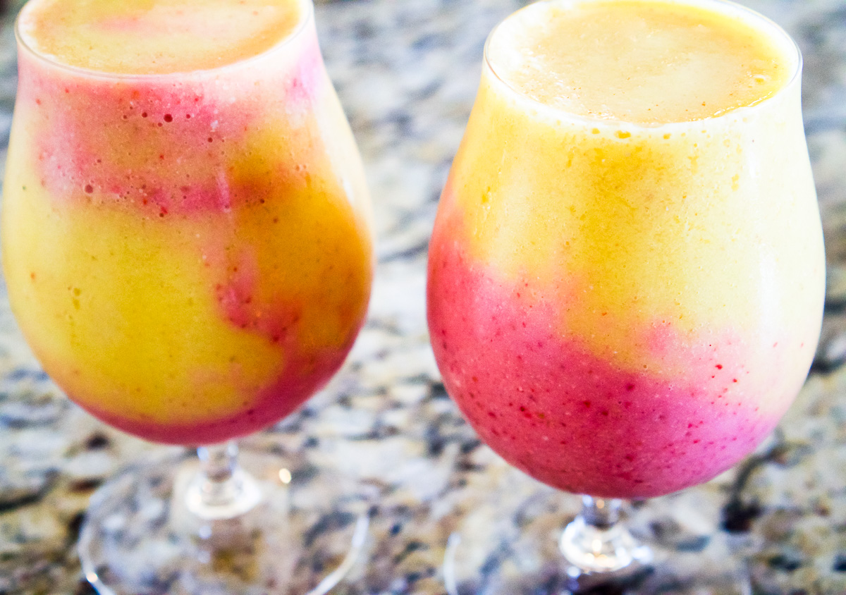 two glasses of healthy colorful drinks