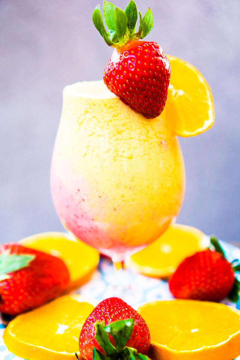 colorful smoothie rich in vitamin C with strawberries and oranges