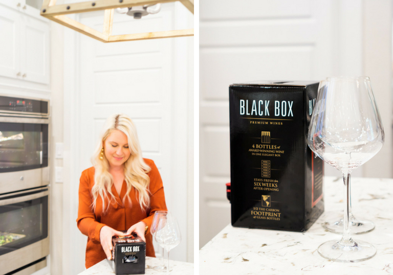 Emily Dunn opening a Black Box Wine